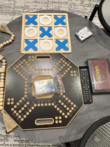 a table with a board game and a remote control at هتان 707 in Jeddah