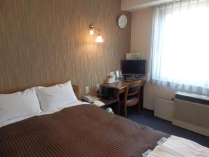Postel nebo postele na pokoji v ubytování Famy Inn Makuhari + 32 fotografií