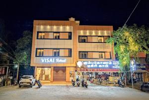 a building with motorcycles parked in front of it at VISAI Retreat in Tiruvannāmalai