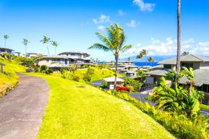 a road leading to a resort with palm trees and houses at Kapalua Bay 31G432B2 FREE CAR KBM Resorts in Honokahua