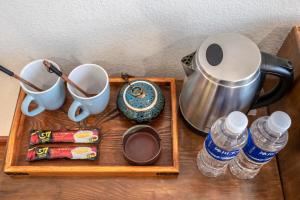 Tiện nghi pha trà/cà phê tại Floral Hotel Lijiang Old Town Xinjingjingju Boutique Inn