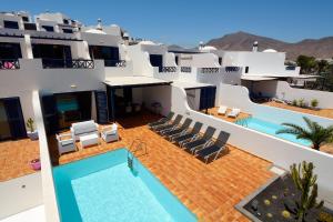 a view of a house with a swimming pool at Villa Oasis in Playa Blanca