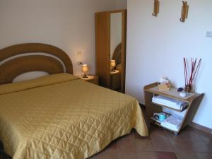 Postel nebo postele na pokoji v ubytování Agriturismo Podere San Michele