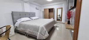 Ένα ή περισσότερα κρεβάτια σε δωμάτιο στο Hotel Apu Kempor