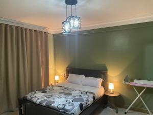 Postel nebo postele na pokoji v ubytování Aurora studio