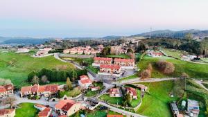 an aerial view of a small village with houses at El Capricho de la Hayuela in Ayuela