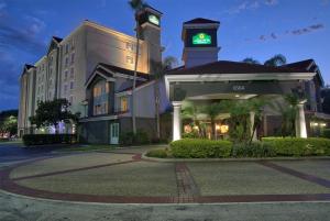 a hotel with a clock tower on top of a building at La Quinta by Wyndham Orlando I Drive/Conv Center in Orlando