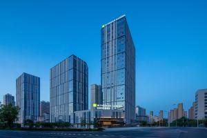 a rendering of a tall building in a city at Wyndham Garden Urumqi Innovation Square in Ürümqi