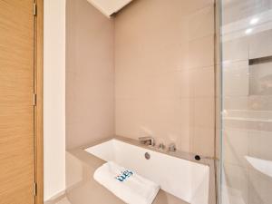 a bathroom with a shower and a bath tub at FAM Living City Walk - Opposite City Walk Mall - 2A in Dubai