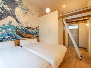Ένα ή περισσότερα κρεβάτια σε δωμάτιο στο Oneness Apartment Akasaka 赤坂