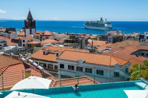 a view of a cruise ship from the roof of a building at Castanheiro Boutique Hotel in Funchal