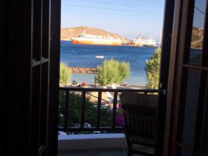 a view of a cruise ship from a window at Asteri Hotel in Livadi