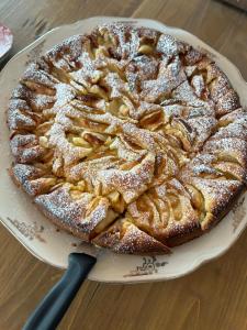 a apple pie on a plate on a table at Il Casale in Colcavagno