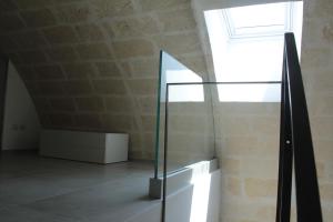 a glass case in a room with a window at Lamia Room Rentals in Matera