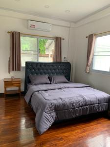 Ένα ή περισσότερα κρεβάτια σε δωμάτιο στο Cozy house in Vientiane