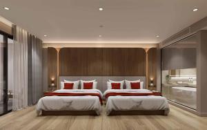 Un pat sau paturi într-o cameră la Ramada Resort by Wyndham Khao Lak