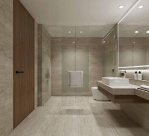 a bathroom with a toilet and a sink and a mirror at Ramada Resort by Wyndham Khao Lak in Khao Lak