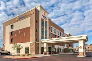 a hotel with a sign on the front of a building at Comfort Suites Scottsdale Talking Stick Entertainment District in Scottsdale