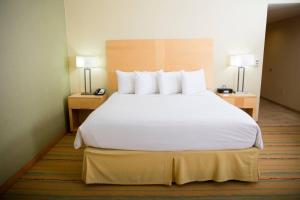 a large white bed in a hotel room at Radisson Hotel Yuma in Yuma