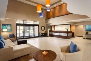a large living room with couches and a table at Townhome Inn & Suites in Memphis