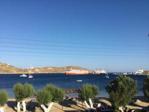 a large boat in a large body of water at Asteri Hotel in Livadi