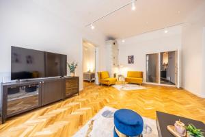 a living room with a large flat screen tv at 74m2 Newly renovated lux furnished Old town in Tallinn