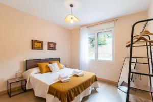 Ένα ή περισσότερα κρεβάτια σε δωμάτιο στο Susurros de río