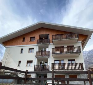 a building with balconies on the side of it at Bardo Chalet in Bardonecchia