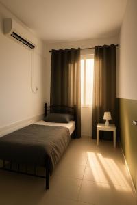 a bedroom with a bed and a window at Private luxury stay Abudhabi in Abu Dhabi