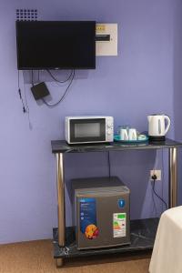 TV a/nebo společenská místnost v ubytování Fuleng Guest House - Quthing + 27 fotografií