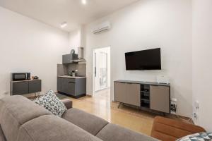 Μια τηλεόραση ή/και κέντρο ψυχαγωγίας στο Almaré Apartment Mondello