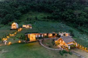 an aerial view of a house on a hill with lights at Phupetra in Ban Thung Phan Ha +42 photos