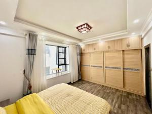 Postel nebo postele na pokoji v ubytování Jie hu er ju hostel