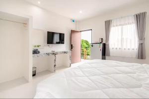 Giường trong phòng chung tại Tonjun Residences Chaweng