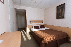 Postel nebo postele na pokoji v ubytování Toila Spa Hotel