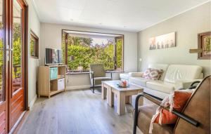 a living room with a couch and a table at Amazing Home In Erm With Wifi in Erm