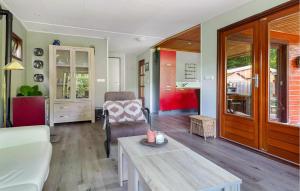 a living room with a couch and a table at Amazing Home In Erm With Wifi in Erm