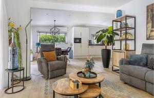 a living room with a couch and a table at 1 Bedroom Stunning Home In Erm in Erm