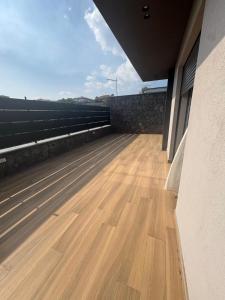a view of a wooden floor on a roof at SICILIA FIERA Apartment in Misterbianco +1 photo