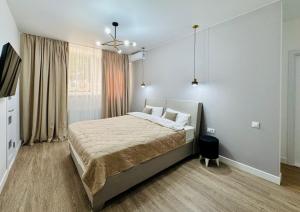 a bedroom with a large bed in a room at CehovHouse in Bălţi