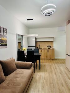 a living room with a couch and a table at CehovHouse in Bălţi +33 photos