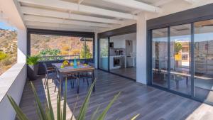 a large living room with a table and a kitchen at Villa Alborada Torrox by Ruralidays in Torrox