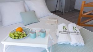 a table with a bowl of fruit and towels on a bed at Villa Alborada Torrox by Ruralidays in Torrox +21 photos