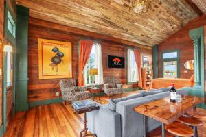 a living room with a couch and a table at Fleur de Tris at Bent Tree Ranch in Lampasas