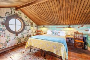 a bedroom with a bed in a room with a window at Bird's Nest at Bent Tree Ranch in Lampasas