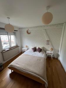 Ένα ή περισσότερα κρεβάτια σε δωμάτιο στο Appartement Cosy & Elégant