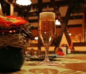 a glass of champagne sitting on top of a table at Hotel und Restaurant am Bismarckturm in Erfurt