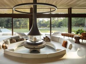 a large living room with couches and a large chandelier at Villa Luxe au Cœur des Landes - Architecture d'Exception - FR-1-791-43 in Magescq