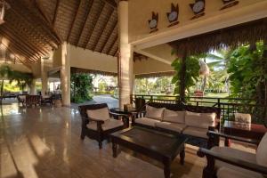 a living room with a couch and chairs and tables at Punta Cana Princess Adults Only - All Inclusive in Punta Cana