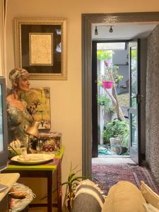 a room with a door with a picture of a woman at Sea Haven in Langebaan